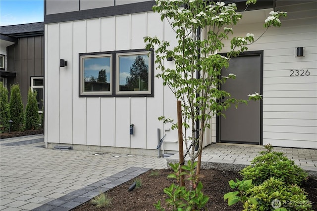 2326 NE 128th St, Seattle, WA 98125 - view of exterior entry featuring board and batten siding