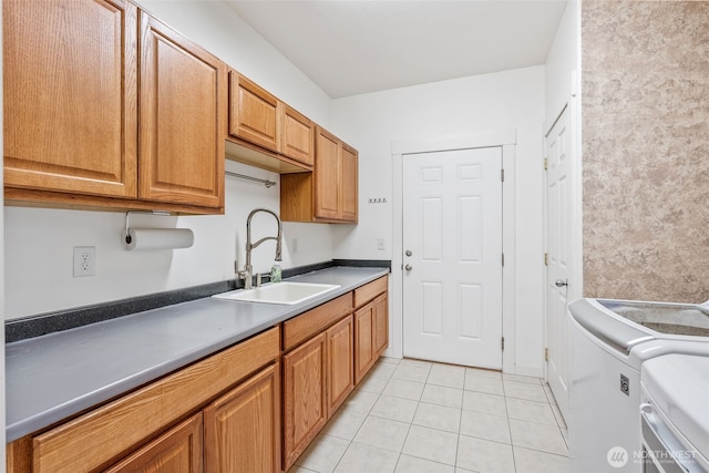 11320 S Stangland Rd, Medical Lake, WA 99022 - kitchen with light tile patterned floors, a sink, washer and clothes dryer, and brown cabinets