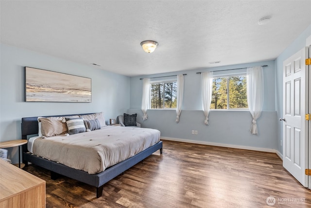 11320 S Stangland Rd, Medical Lake, WA 99022 - bedroom featuring baseboards, visible vents, wood finished floors, and a textured ceiling