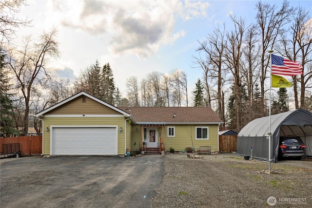 single story home with an attached garage, entry steps, driveway, and fence