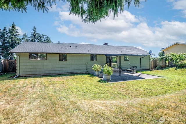 2302 126th Avenue Ct E, Edgewood, WA 98372 - back of property with a patio area and a shingled roof