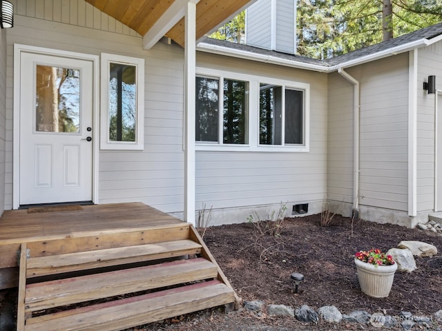 property entrance with crawl space and a chimney