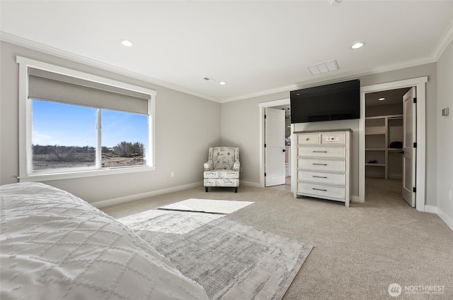 bedroom with crown molding, baseboards, recessed lighting, a walk in closet, and light colored carpet