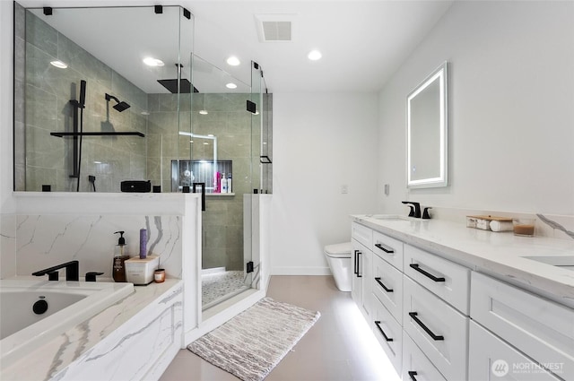 bathroom featuring visible vents, double vanity, toilet, a sink, and a stall shower