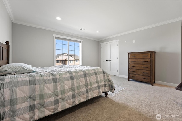 bedroom with crown molding, baseboards, a closet, and light colored carpet