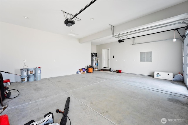 garage with electric panel and a garage door opener