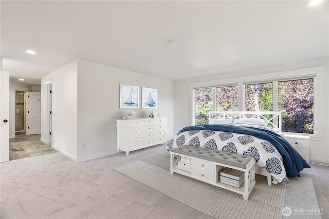 carpeted bedroom featuring baseboards and recessed lighting