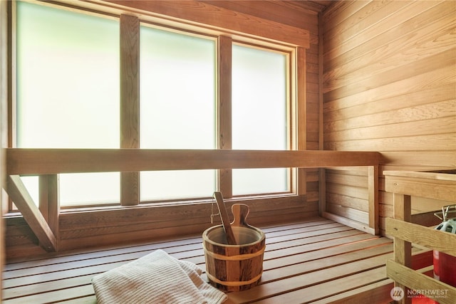 sauna / steam room with wooden walls