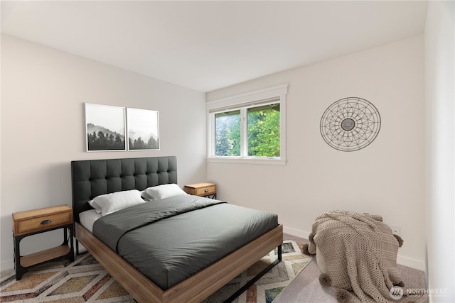 carpeted bedroom with baseboards