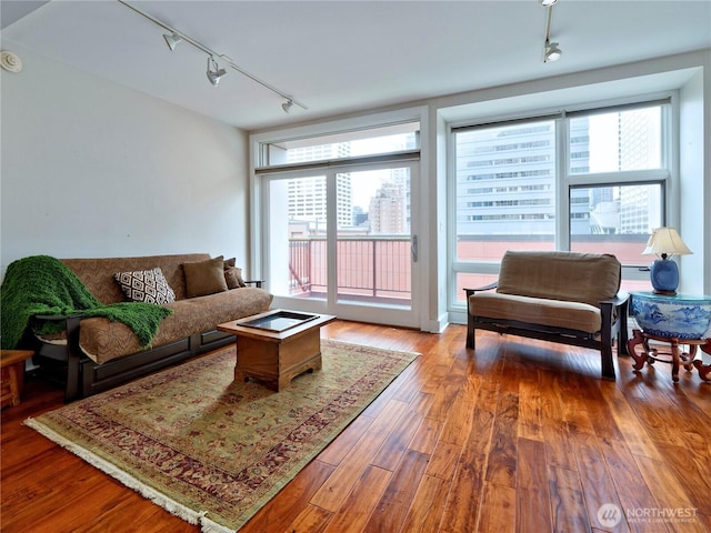1500 4th Ave Unit 905, Seattle, WA 98101 - living room featuring track lighting and wood finished floors