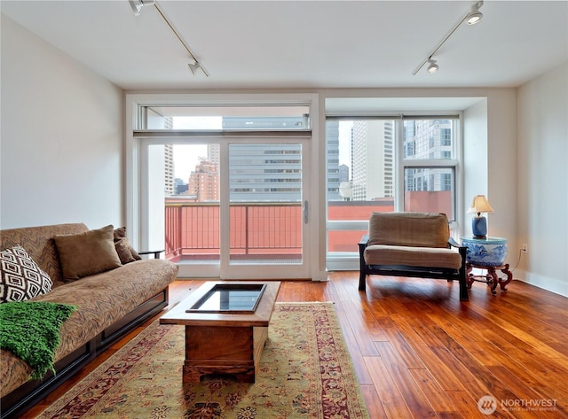 1500 4th Ave Unit 905, Seattle, WA 98101 - living area with plenty of natural light, hardwood / wood-style floors, and track lighting