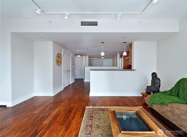 1500 4th Ave Unit 905, Seattle, WA 98101 - living area featuring baseboards, wood-type flooring, visible vents, and track lighting