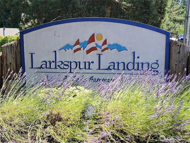 community sign with fence