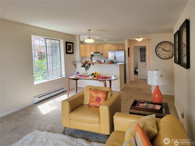 living room with baseboard heating, baseboards, recessed lighting, and light colored carpet