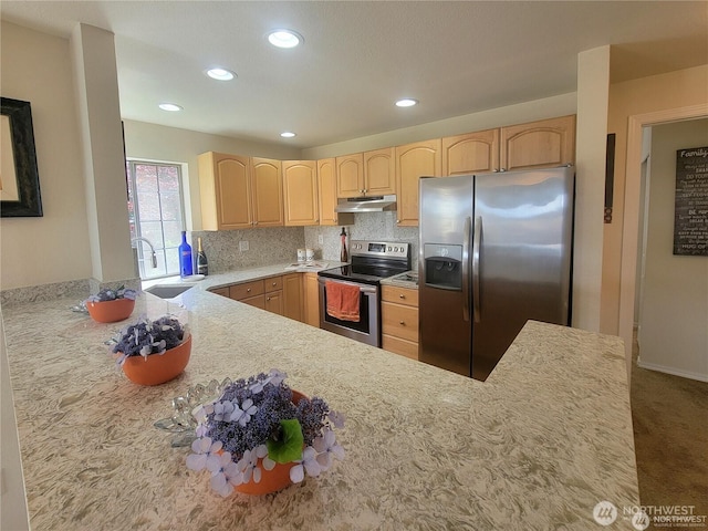 kitchen featuring stainless steel appliances, a sink, tasteful backsplash, light brown cabinets, and under cabinet range hood