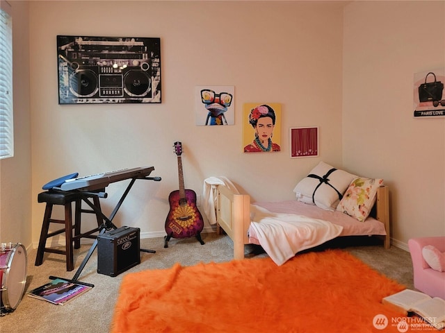 sitting room with carpet floors and baseboards