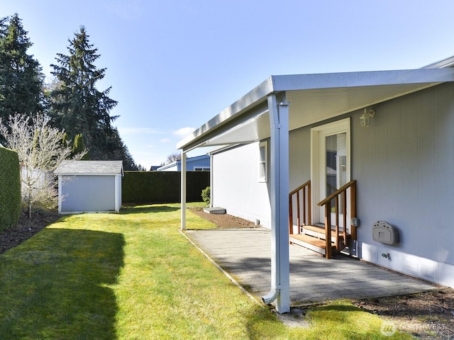 6012 91st Street Ct E, Puyallup, WA 98371 - view of yard featuring a storage unit, fence, entry steps, and an outdoor structure
