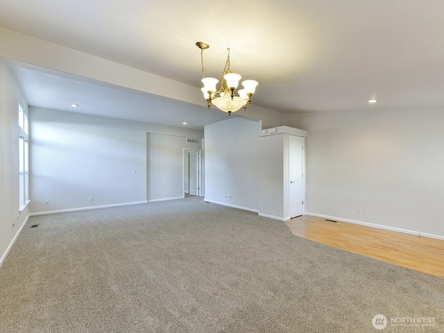 6012 91st Street Ct E, Puyallup, WA 98371 - carpeted spare room with an inviting chandelier, baseboards, and recessed lighting