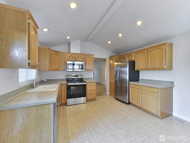 6012 91st Street Ct E, Puyallup, WA 98371 - kitchen with light countertops, recessed lighting, appliances with stainless steel finishes, a sink, and vaulted ceiling