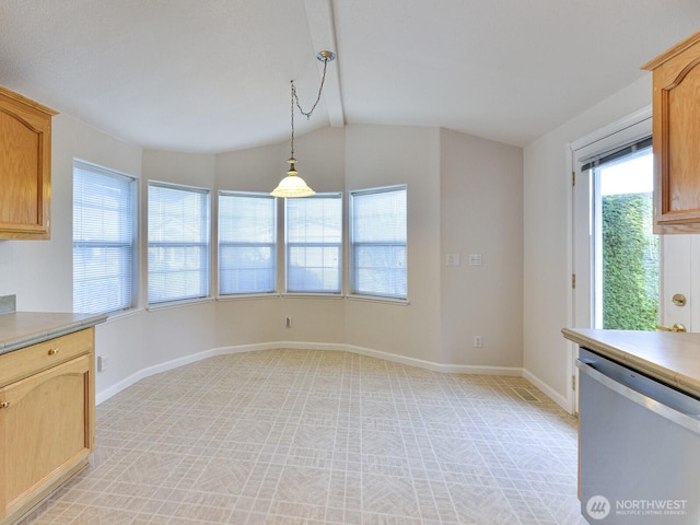 6012 91st Street Ct E, Puyallup, WA 98371 - kitchen with light countertops, lofted ceiling, baseboards, stainless steel dishwasher, and pendant lighting