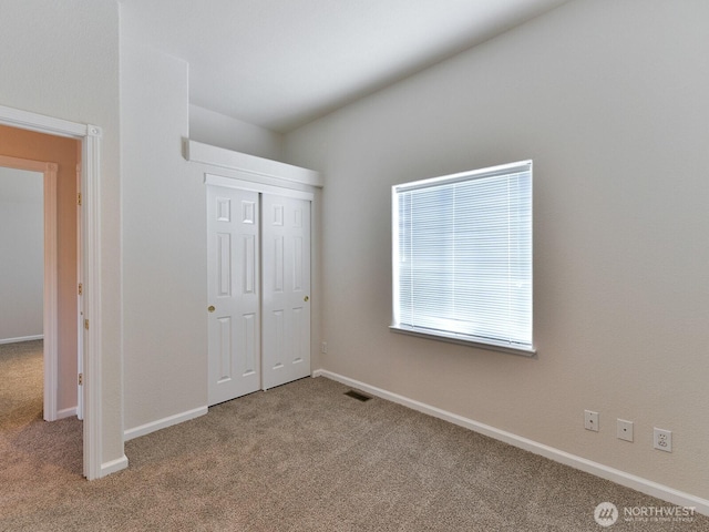 6012 91st Street Ct E, Puyallup, WA 98371 - unfurnished bedroom featuring carpet floors, baseboards, a closet, and visible vents