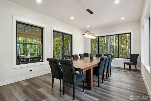 dining room featuring dark wood finished floors, baseboards, and recessed lighting