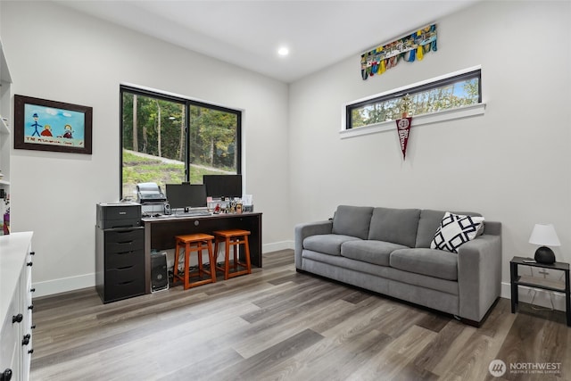 home office with recessed lighting, baseboards, and wood finished floors