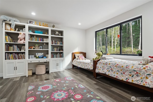 bedroom featuring wood finished floors and recessed lighting
