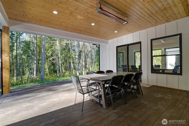 wooden deck with outdoor dining space
