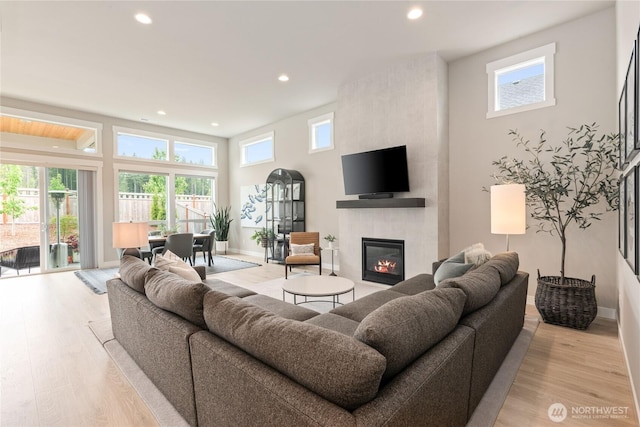 6346 Marymere Rd SW, Port Orchard, WA 98367 - living room featuring a fireplace, recessed lighting, and light wood finished floors