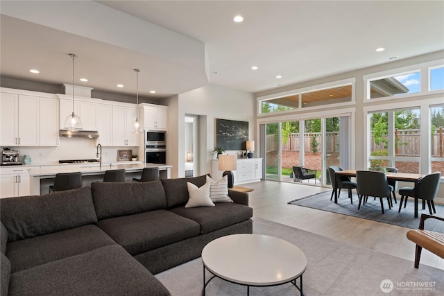 6346 Marymere Rd SW, Port Orchard, WA 98367 - living room with light wood-style flooring, recessed lighting, and a high ceiling