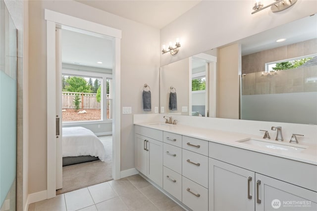 6346 Marymere Rd SW, Port Orchard, WA 98367 - ensuite bathroom featuring plenty of natural light, double vanity, tile patterned flooring, a tile shower, and recessed lighting