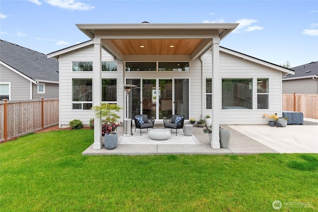 6346 Marymere Rd SW, Port Orchard, WA 98367 - back of property with a patio area, an outdoor hangout area, and a fenced backyard