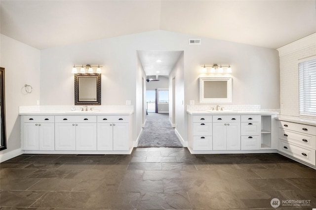 6 Pelican Pl SE, Moses Lake, WA 98837 - bathroom featuring a sink, a healthy amount of sunlight, vaulted ceiling, and visible vents