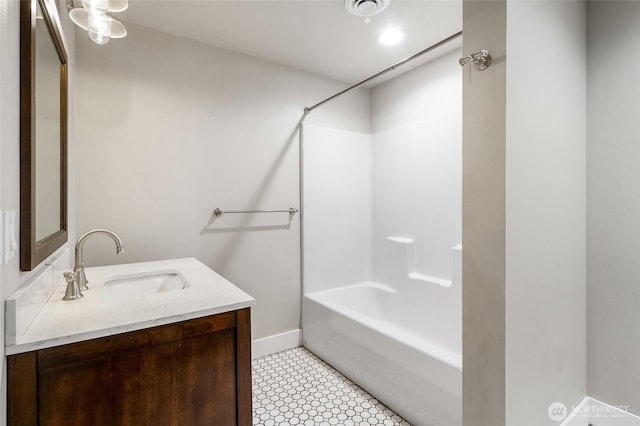 6 Pelican Pl SE, Moses Lake, WA 98837 - full bathroom with baseboards, tub / shower combination, a sink, visible vents, and double vanity