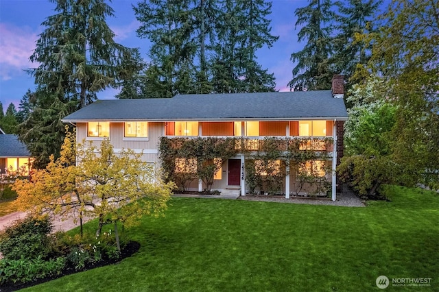 15126 NE 67th Pl, Redmond, WA 98052 - back of property at dusk with a lawn and a chimney