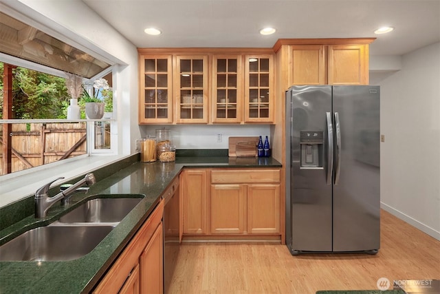 15126 NE 67th Pl, Redmond, WA 98052 - kitchen featuring a sink, glass insert cabinets, light wood finished floors, and stainless steel refrigerator with ice dispenser