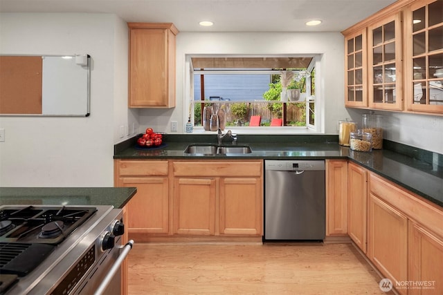 15126 NE 67th Pl, Redmond, WA 98052 - kitchen featuring a sink, light wood-style floors, stainless steel appliances, recessed lighting, and glass insert cabinets
