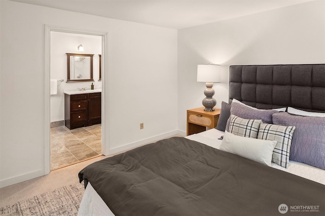 15126 NE 67th Pl, Redmond, WA 98052 - bedroom with connected bathroom, baseboards, light carpet, and a sink