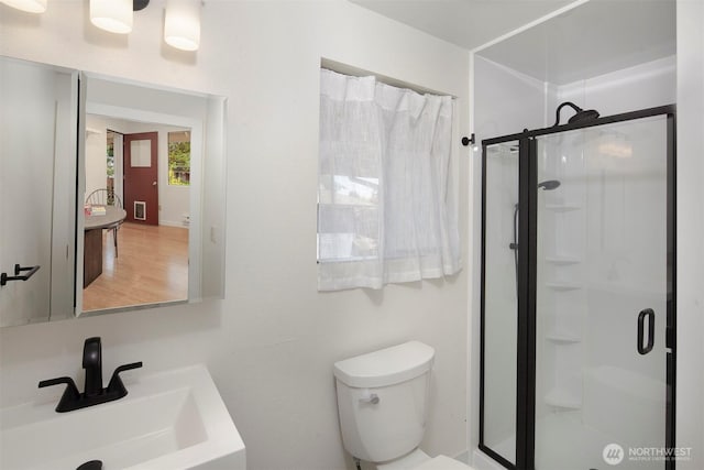 15126 NE 67th Pl, Redmond, WA 98052 - full bathroom featuring toilet, a sink, and a stall shower