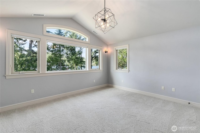 1220 Madrona Beach Rd NW, Olympia, WA 98502 - empty room featuring visible vents, baseboards, vaulted ceiling, and carpet floors