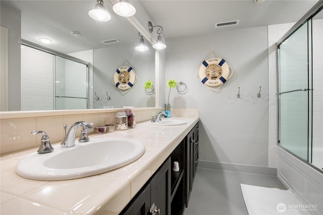 1220 Madrona Beach Rd NW, Olympia, WA 98502 - bathroom featuring tile patterned flooring, visible vents, and a sink