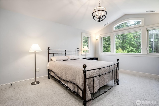 1220 Madrona Beach Rd NW, Olympia, WA 98502 - carpeted bedroom featuring visible vents, baseboards, an inviting chandelier, and vaulted ceiling