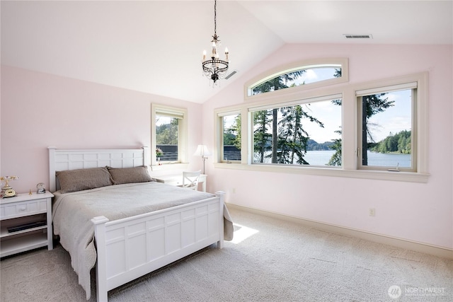 1220 Madrona Beach Rd NW, Olympia, WA 98502 - bedroom featuring visible vents, baseboards, a chandelier, light colored carpet, and lofted ceiling
