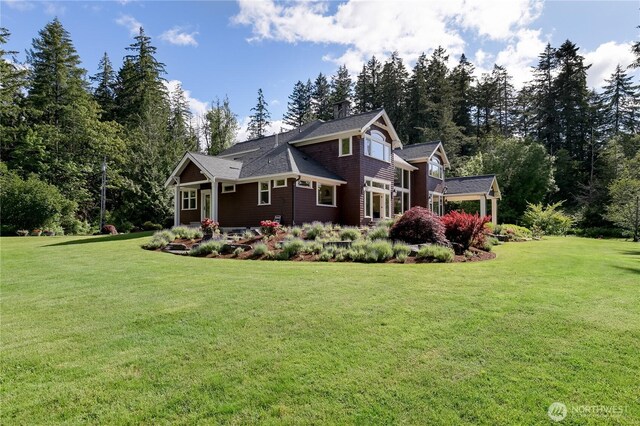 1220 Madrona Beach Rd NW, Olympia, WA 98502 - view of home's exterior with a lawn