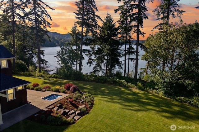 1220 Madrona Beach Rd NW, Olympia, WA 98502 - view of yard with a water view and a patio