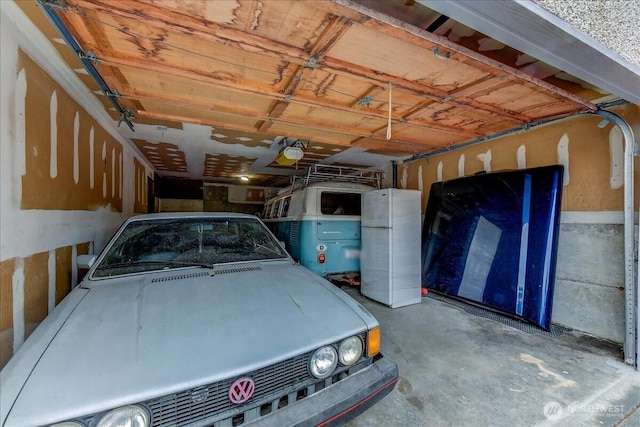 4509 Eastern Ave N Unit 1-3, Seattle, WA 98103 - garage featuring a garage door opener and freestanding refrigerator