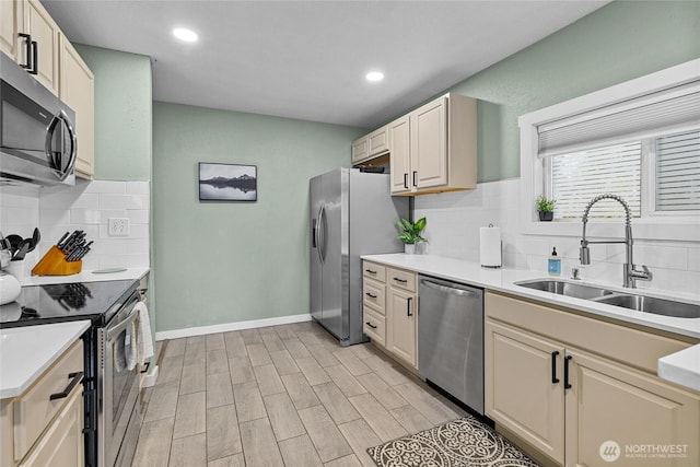 417 W 2nd St, Cle Elum, WA 98922 - kitchen with a sink, light countertops, baseboards, and appliances with stainless steel finishes
