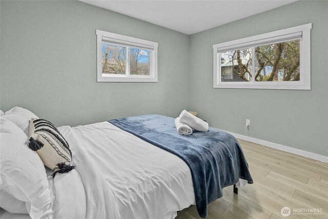 417 W 2nd St, Cle Elum, WA 98922 - bedroom featuring baseboards and wood finished floors