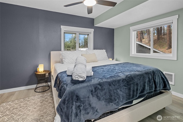 417 W 2nd St, Cle Elum, WA 98922 - bedroom featuring baseboards, visible vents, wood finished floors, and ceiling fan